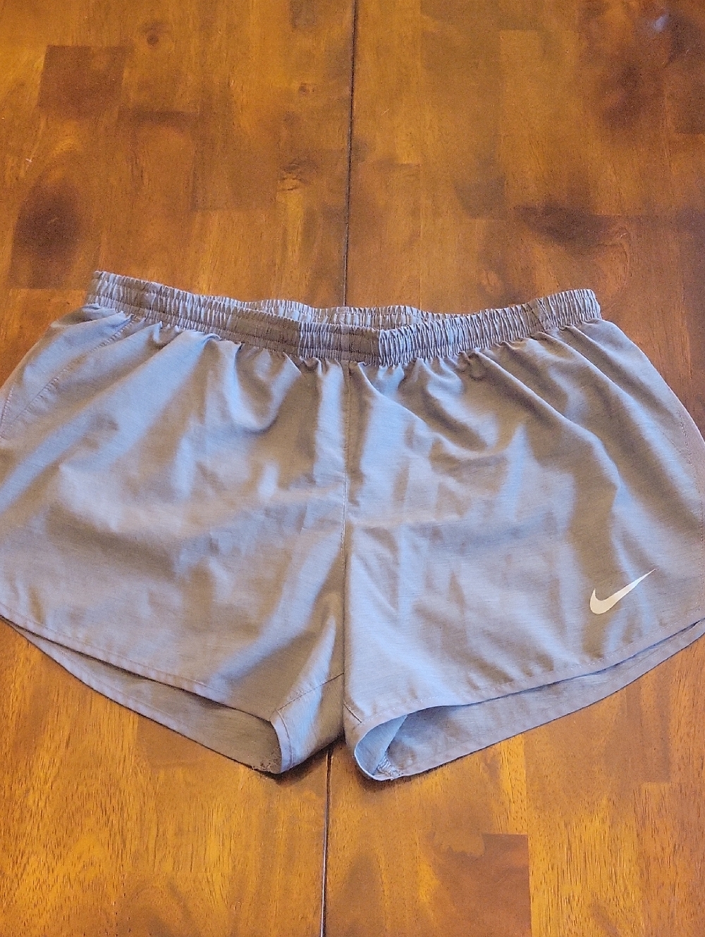 Nike Women's Light Gray Lined Athletic Shorts with Swoosh
